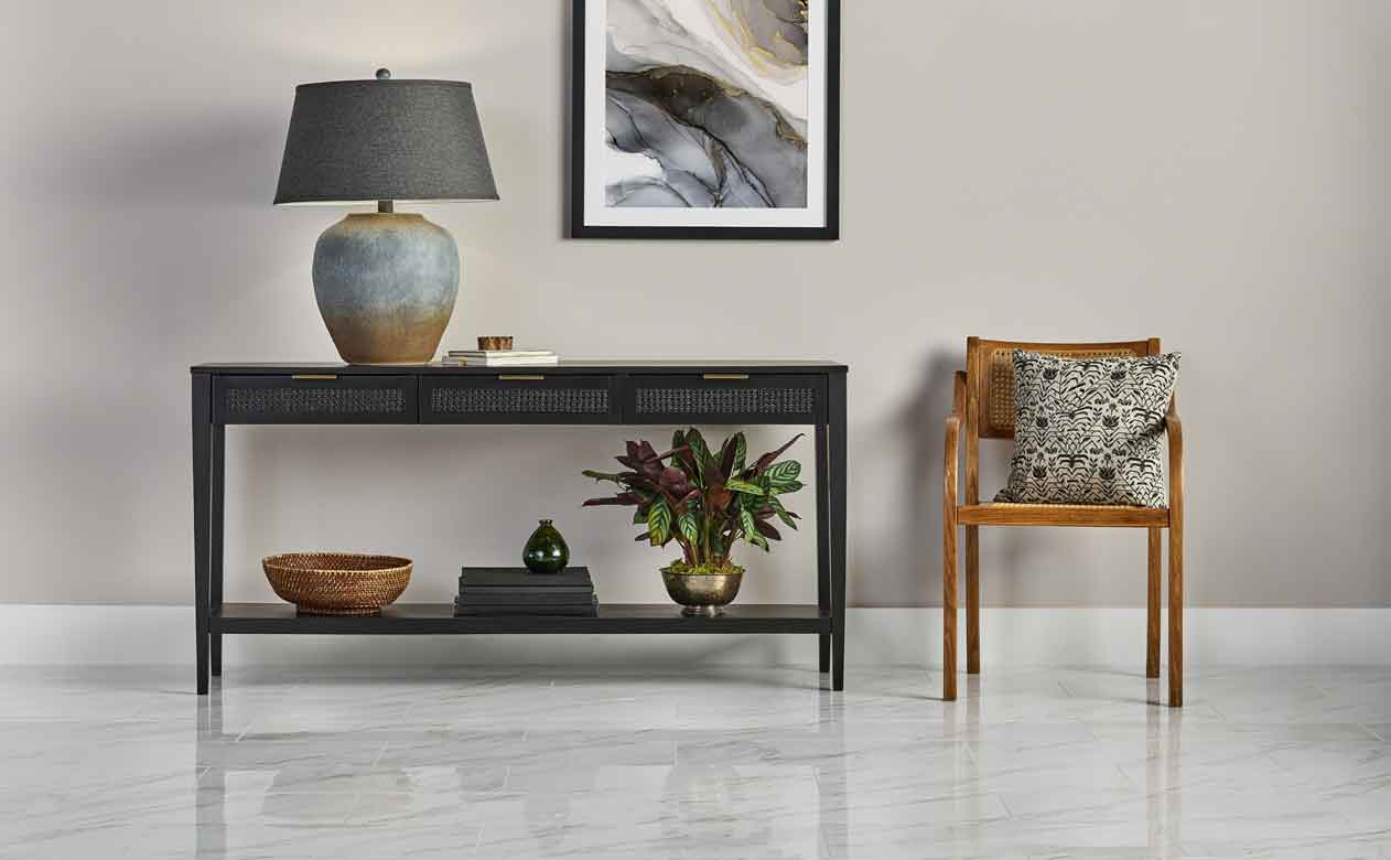 Living room in Flagstaff with Woven Drawer Console Table Black and marble look tile flooring